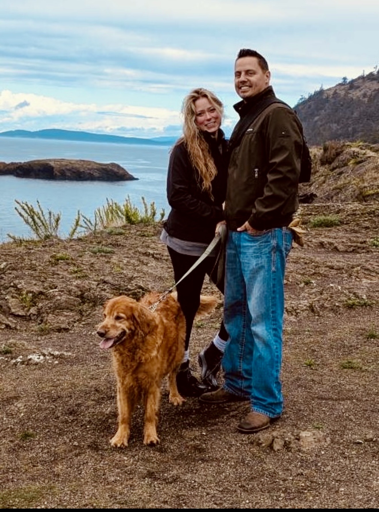 Juan and Kylee together outdoors with their dog